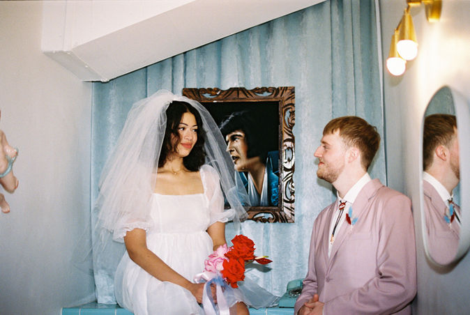Las vegas elopement film photographer captures weddings on 35mm film. Vegas kitsch wedding vibes at the sure thing chapel. Analog photobooth in downtown las vegas. 