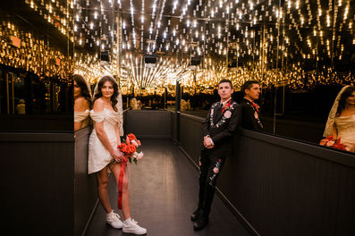 Las Vegas wedding photographer brazen honey films captures an epic elopement at sure thing chapel with elvis officiant. Photoshoot at the neon museum and downtown las vegas with neon lights.