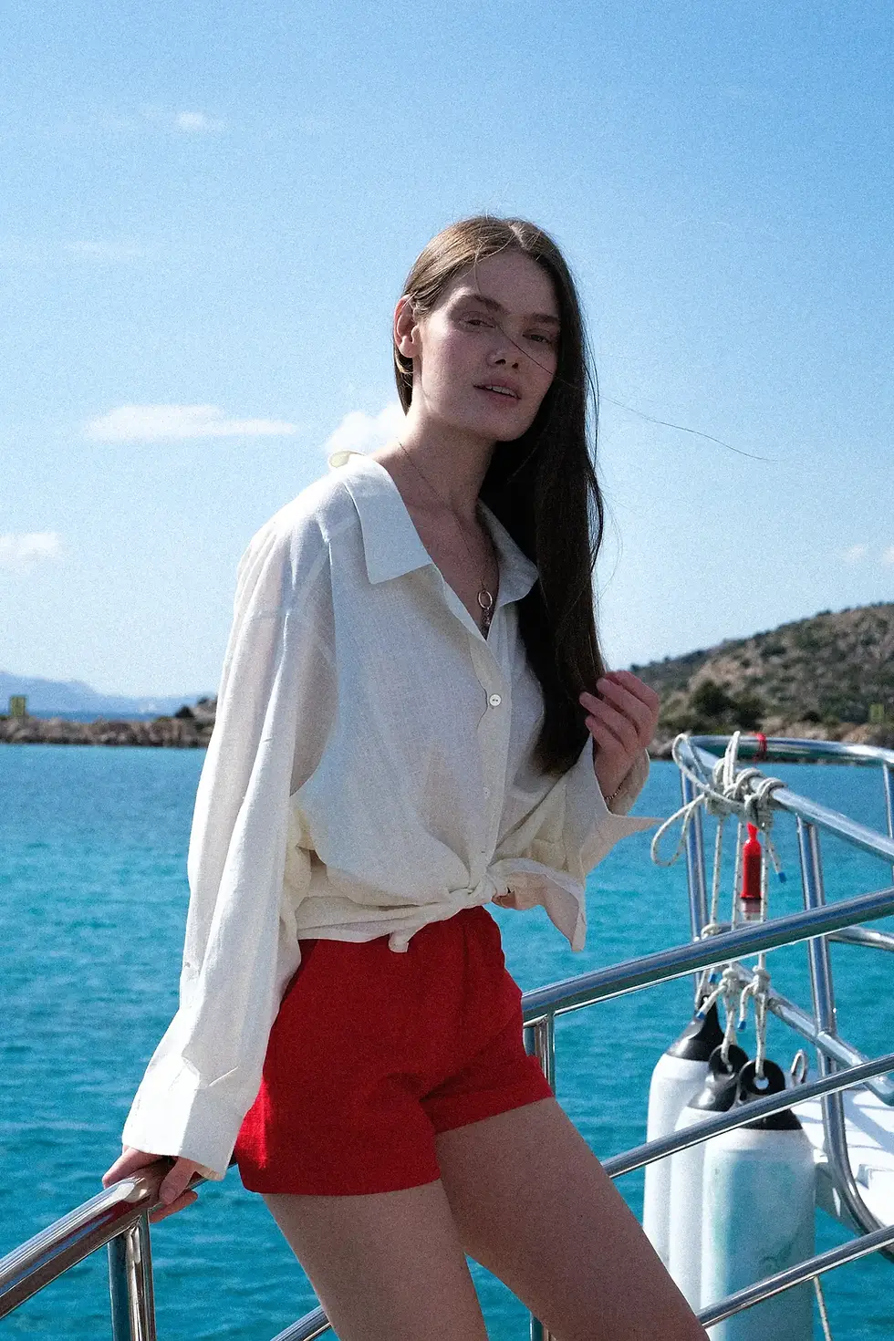 Thumbnail: womens off-white oversize cotton shirt side view on Adini Sen Koy yacht scene in Bozburun by me like summer