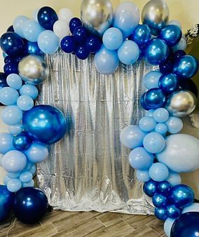 glitter backdrop with balloon arch