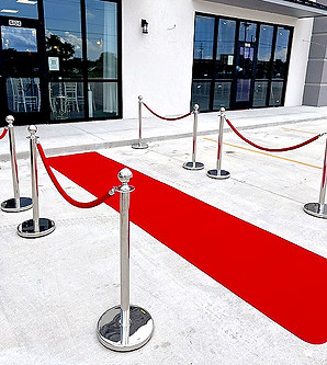red carpet with silver rope poles