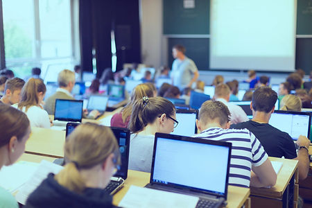 college_lecture_hall_several_computers_open_edited.jpg