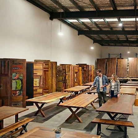 Customers browsing reclaimed timber furniture in the Timber Feeling Campbellfield showroom