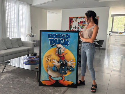 Iconic “Donut Duck QUACKIN since 1934” Painting by Inga Sleng Finds New Home in Cyprus