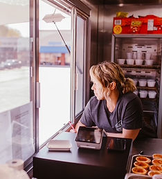 Owner taking an order at the food truck window at Southern Smokehouse Dickson, TN