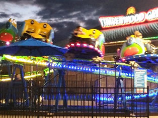 my photo of a kids' roller coaster in the evening at The Island in Pigeon Forge