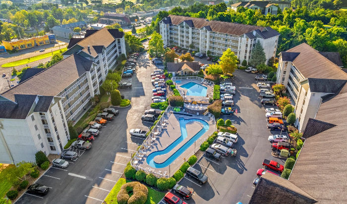 Walkable condo in Pigeon Forge, Tennessee, showing swimming pools, parking and lazy river.