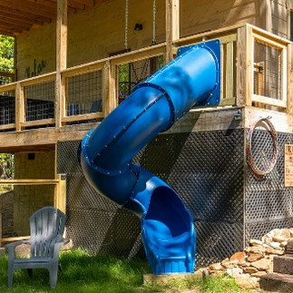 Playful slide attached to the side of cabin rental deck in Sevierville, Tennessee