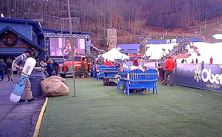 snow boarder at Ober Mountain and huge outdoor tv, and ski slopes