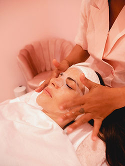 Facial treatment with hands and products on a woman Lymphatic By Carla