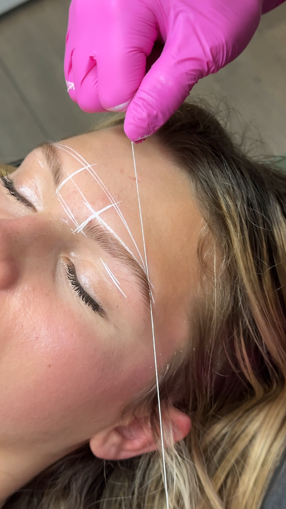 Brow mapping with the string method before an eyebrow wax at The Beauty Room & Co in Round Rock TX