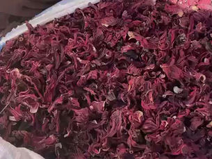 Flores de flor de Jamaica a granel provenientes de Nigeria, mostrando hibisco seco de alta calidad con color rojo intenso, listo para exportación a importadores, mayoristas y distribuidores internacionales.