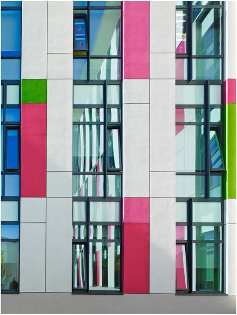 Green and pink tiles around windows, at King's Mill Hospital