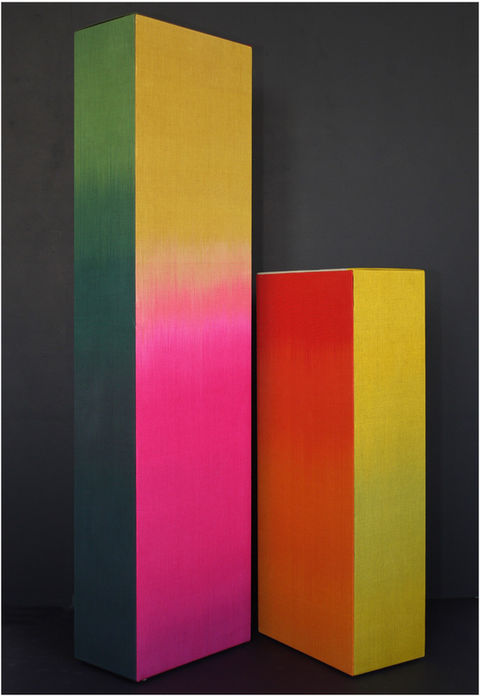 Two colourful woven boxes standing together, designed by Ptolemy Mann