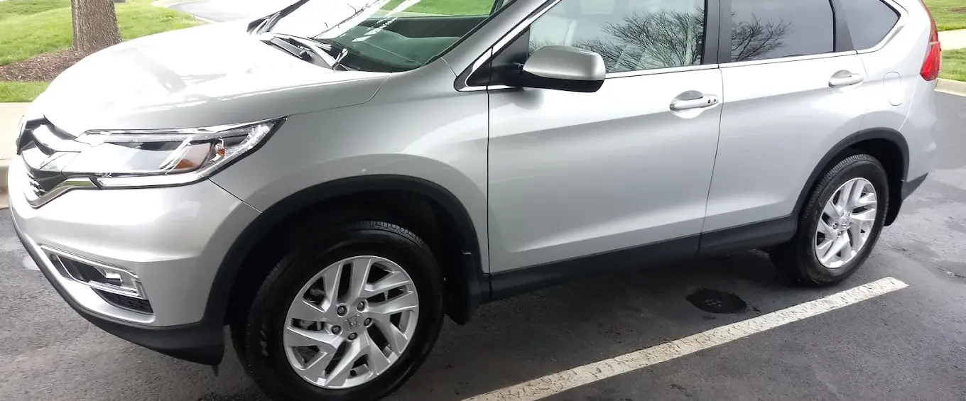 Silver Honda CR-V parked on asphalt in daylight, Sunshine Mobile Detailing