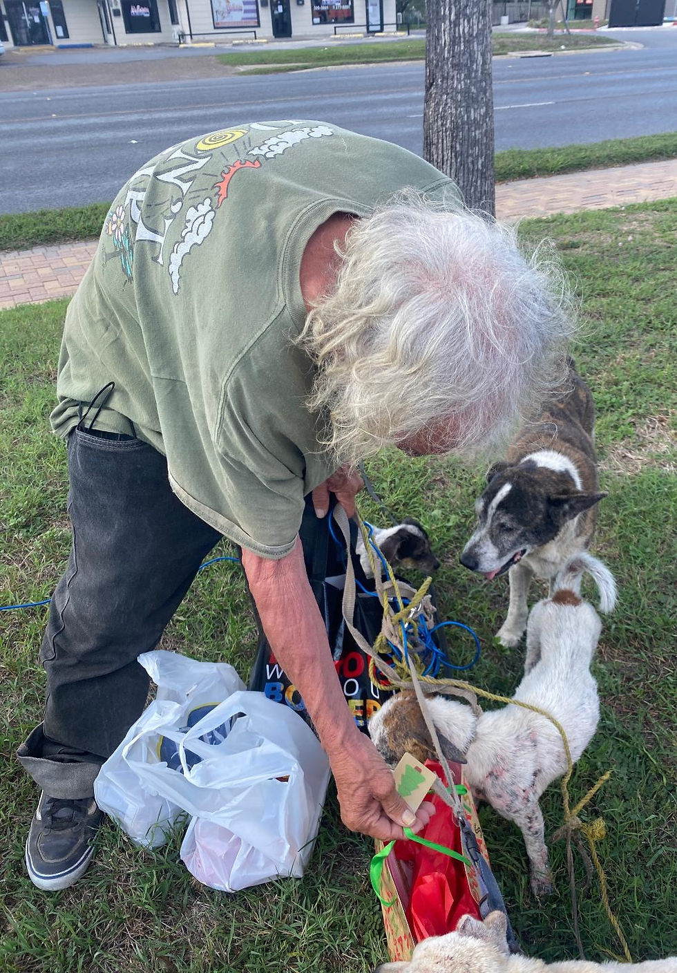 Homeless man looking inside his bag