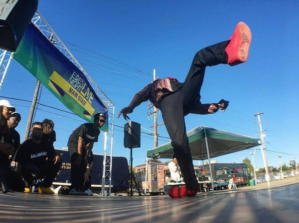 Local dancer breakdancing on the stage at Eden Night Live