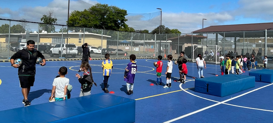 DSAL Soccer Program Participants Playing on the courts
