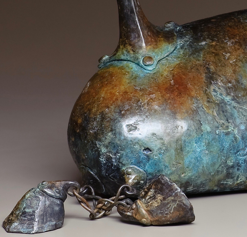 horse with legs of chain linked to hoover