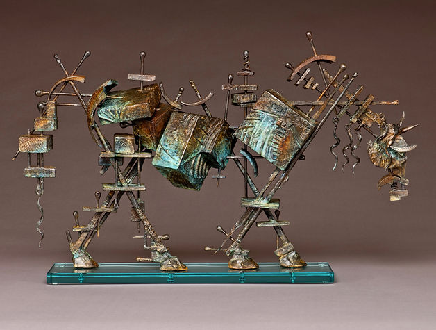 Standing bronze horse made up of various textured boxes held together with skewers.