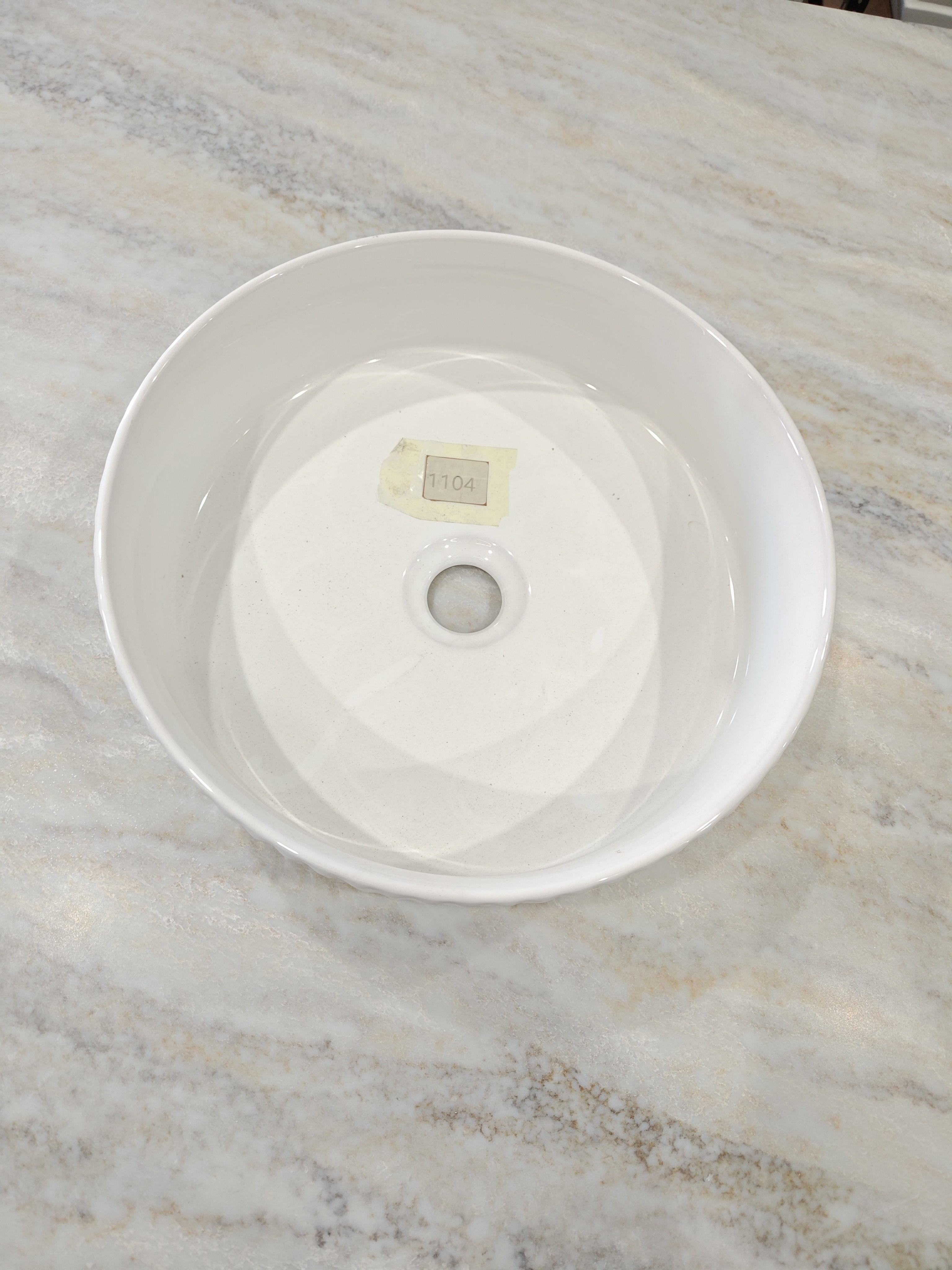 Top view of a Pearl Ripple Basin on a marble surface