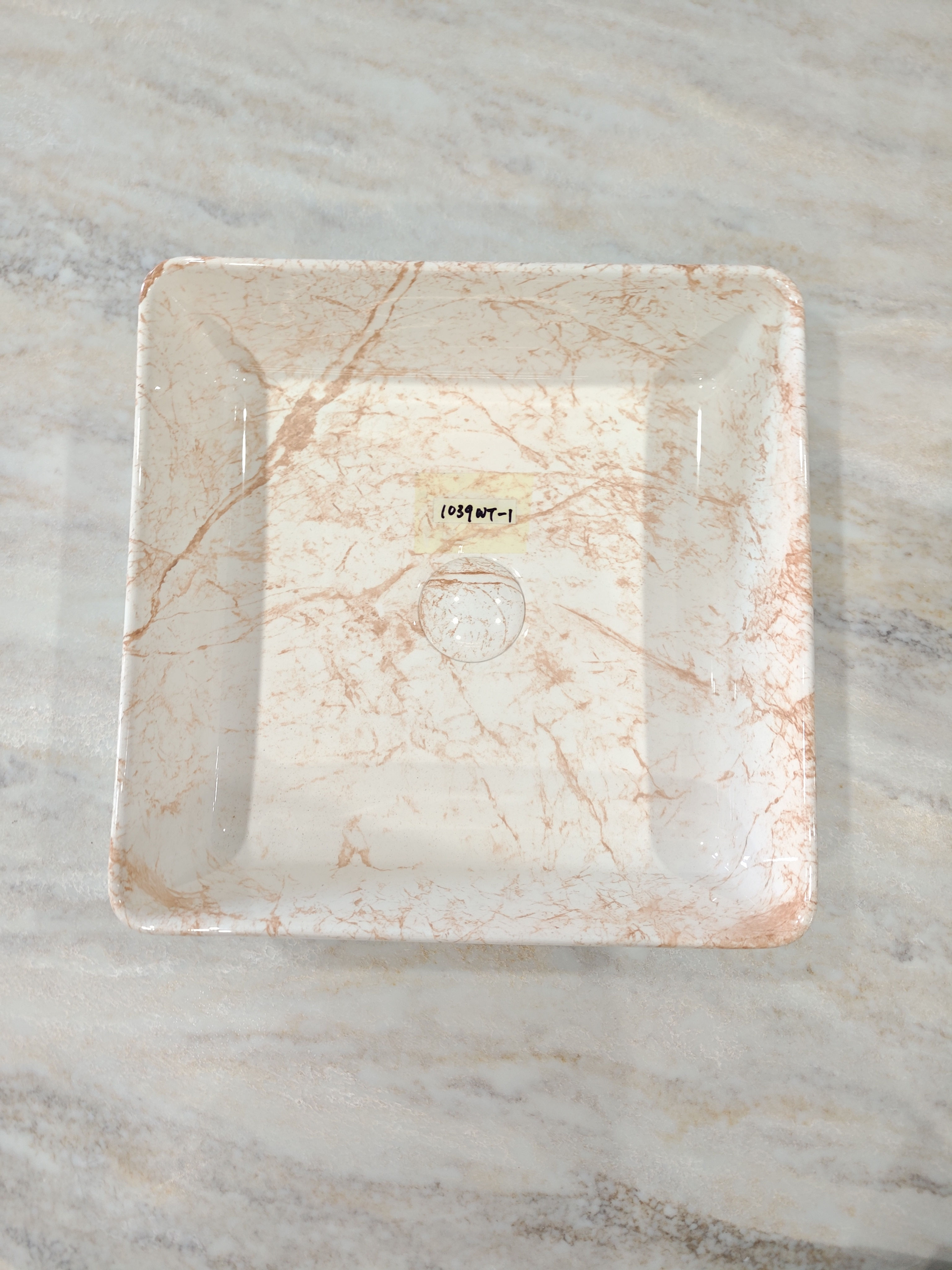 Top view of a Rose Vein Square Basin with marble texture.