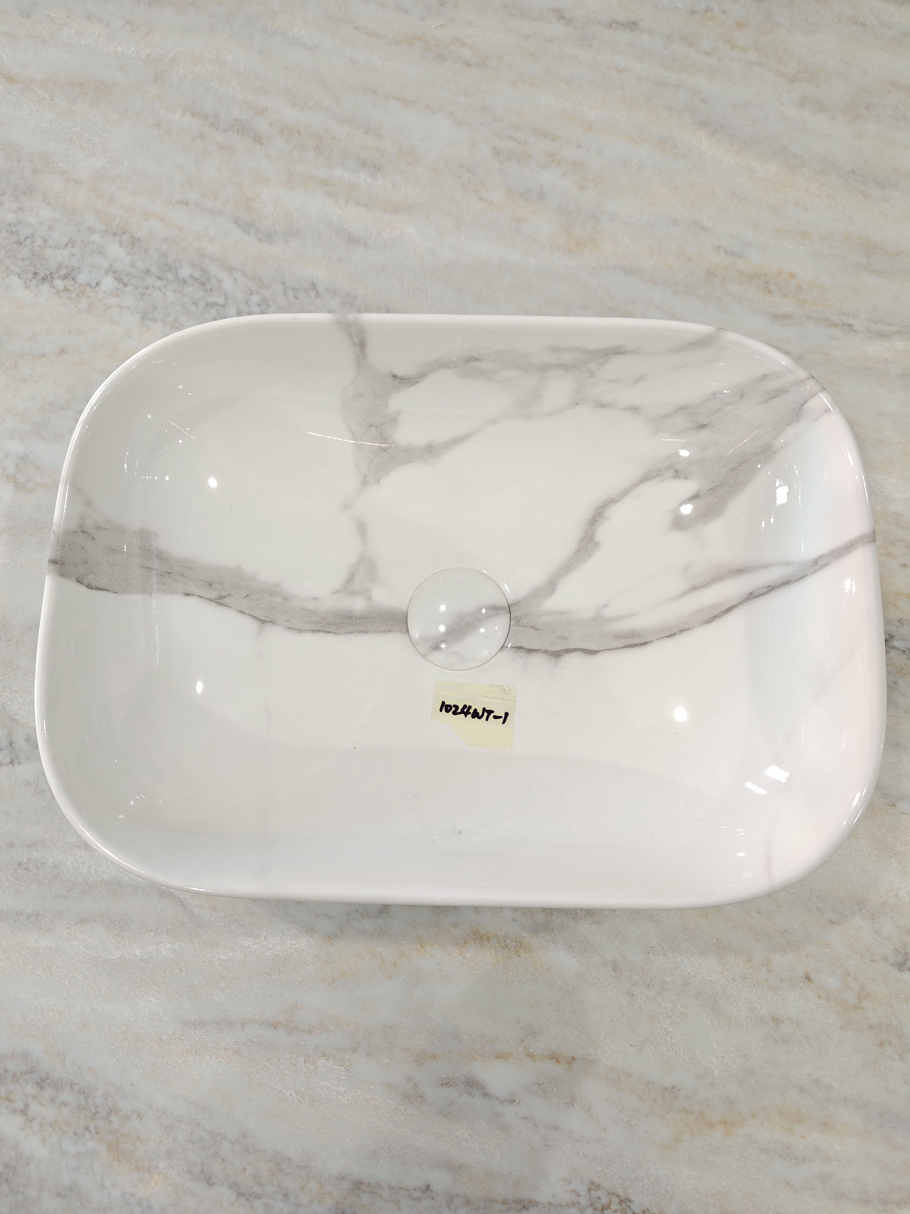 Top view of a Calacatta Mist Basin with grey veining.