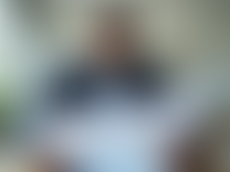 South African small business owner reviewing financial documents at a desk