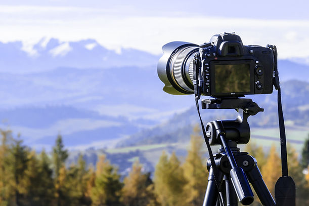 camera taking photo of landscape
