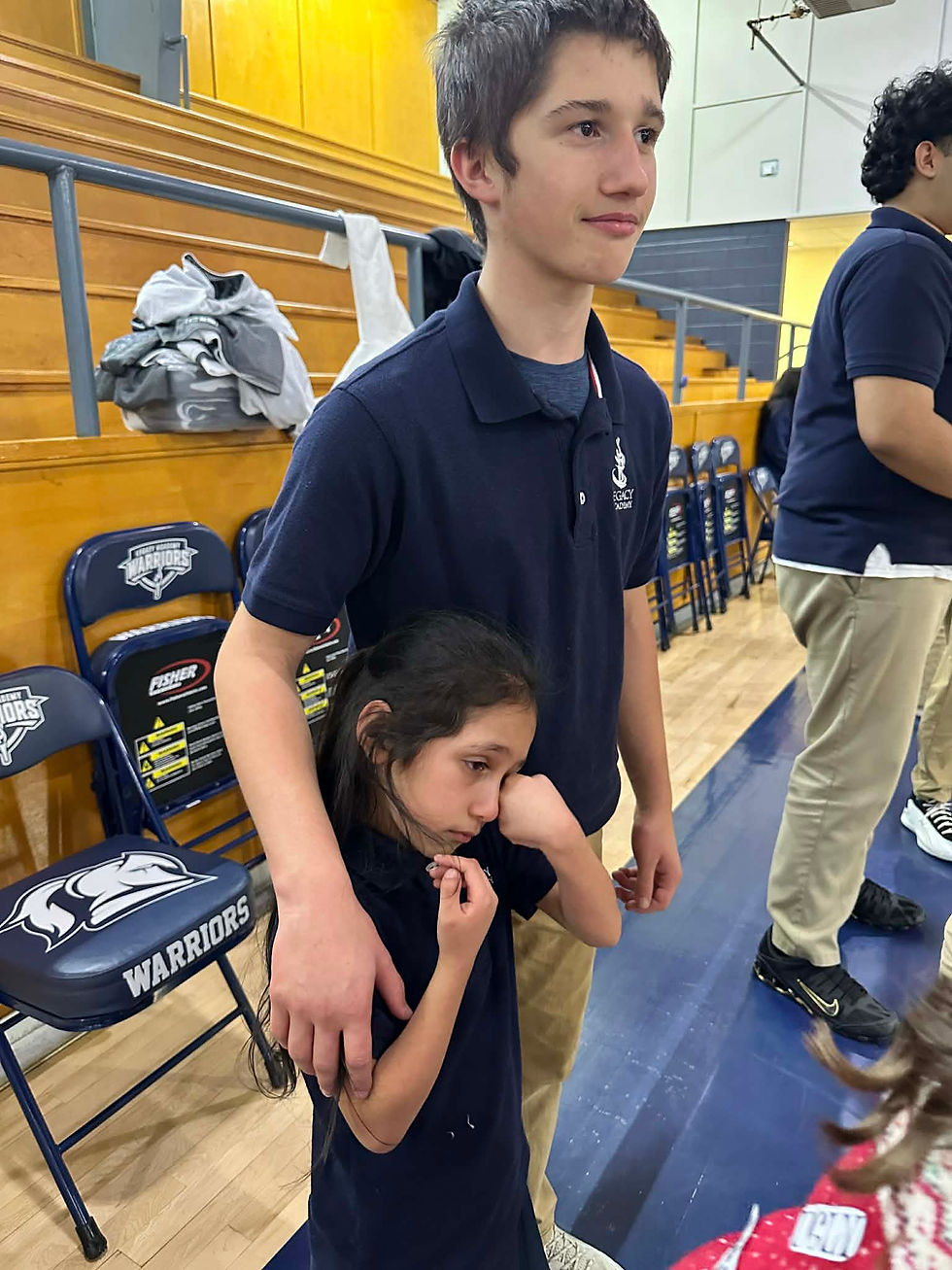 Wyatt comforting Yareli after being hit with a dodge ball!