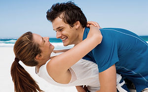 Couple embracing and smiling enjoying the effects of the More than a Vaccine formula