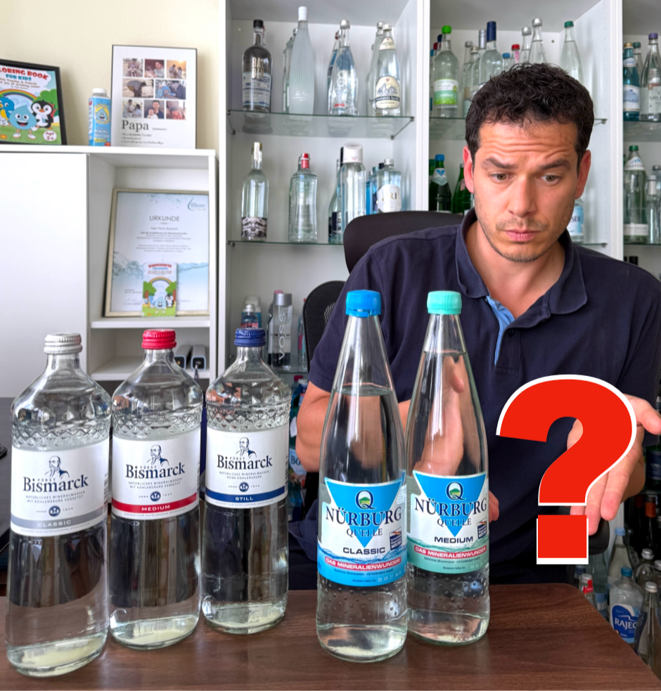 Timo Bausch, Wassersommelier mit verschiedenen Mineralwässern
