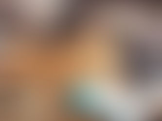 People in a marketing strategy meeting with notes and laptops.