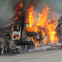 A Semi Truck Burns Out Of Control On The Highway.jpg