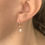 Thumbnail: Pearl Huggie Hoop Earrings