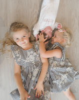 older sisters and newborn cuddle moments
