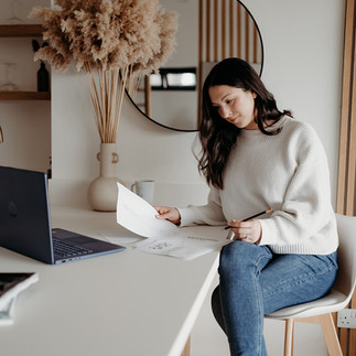 Rebecca Anne sketches an embroidered veil design in her studio, bringing bespoke bridal visions to life with artistry and precision.