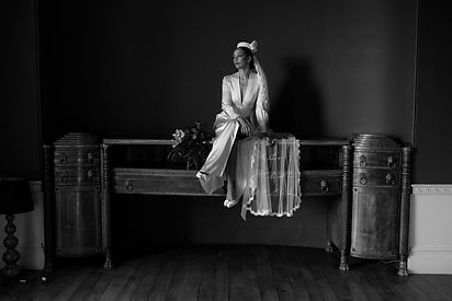 Bride wearing a lace edge veil with poem embroidery stitched into the tulle