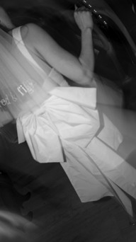 Detail shot of veil embroidery and sculptural bow moving through light – artistic veil photography showing texture, energy, and joy.