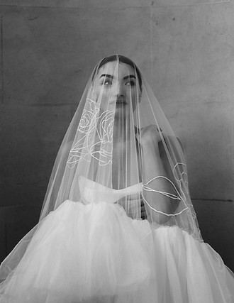 Bride wearing a couture embroidered veil with floral detailing, handcrafted to the highest standard by Rebecca Anne Designs bridal studio in Devon.