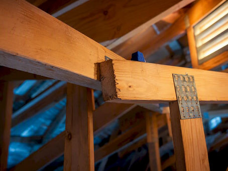 Cut roof truss joint in Gulf Coast attic
