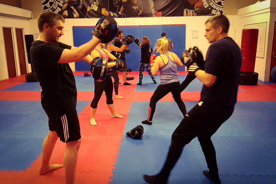 Image of mn and women at one of the CDA Academies Fitness clsses Cardio Kickboxing