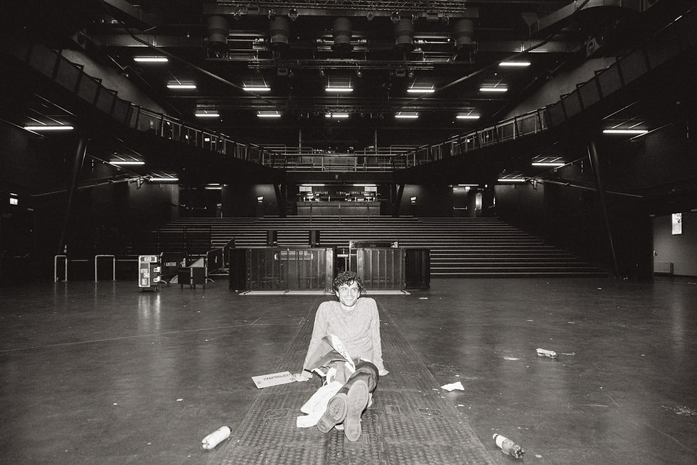 Sitting in the broken-down venue during my biggest headline show to date in Tilburg, Netherlands. Was super tired but also on cloud nine.