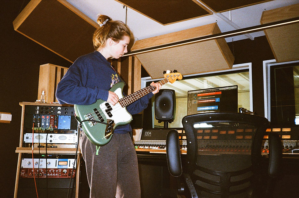Cin laying down the bass, classic scenario of laying it down and then having to relearn it while singing the chorus for live.