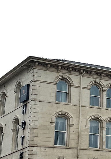 Hotel in white sandstone with multiple windows png.png