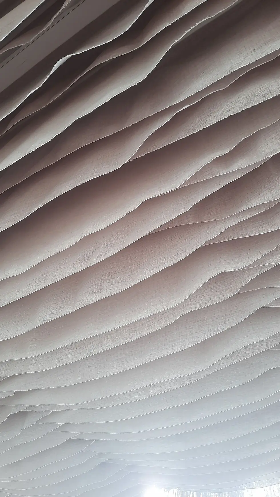 Ceiling detail at Saklıyaz Roof Restaurant with flowing fabric strips creating a soft, sculptural effect