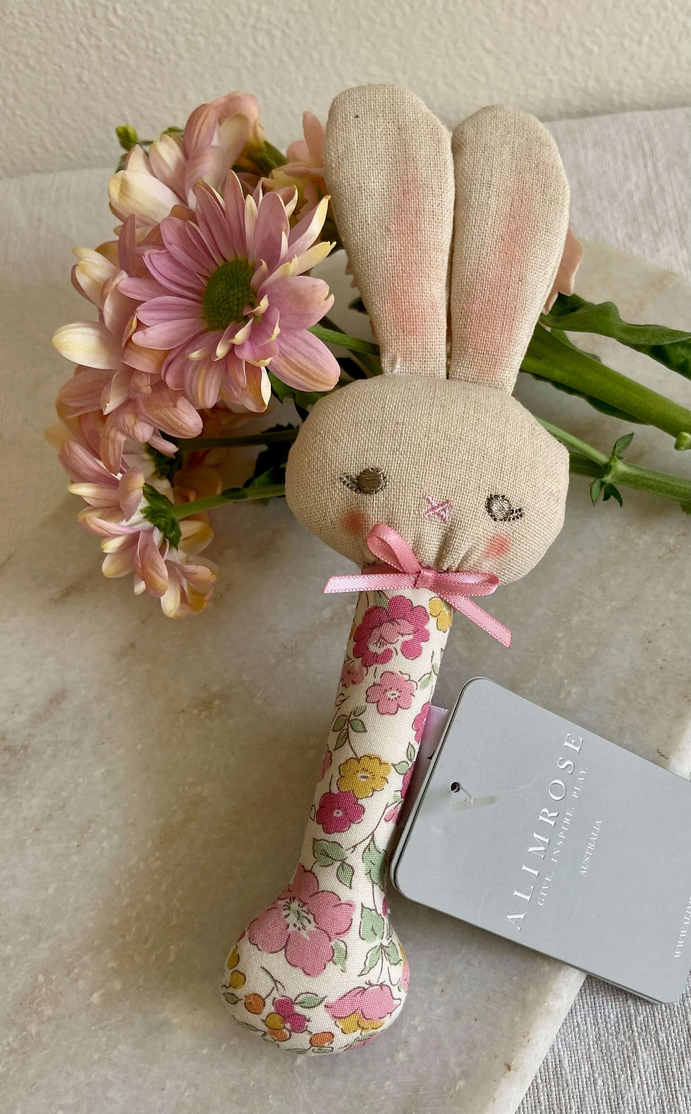 Alimrose baby rattle in Rose Garden Blossom floral cotton, soft pastel pinks and blooms