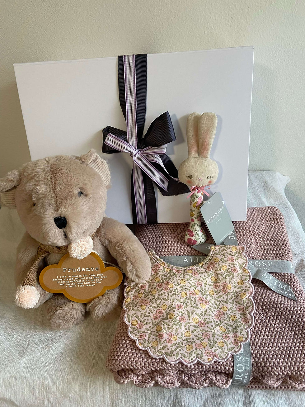 Cherry Blossom Hamper comes with Prudence Bear, baby blanket, bib and rattle. Perfect gift for new baby girl.