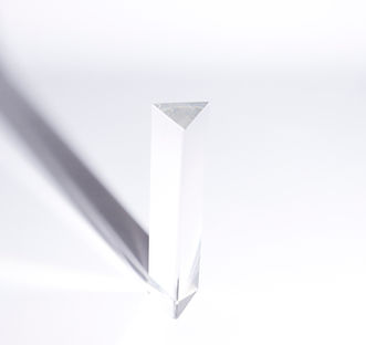 overhead-view-triangular-prism-with-dark-shadow-white-background.jpg