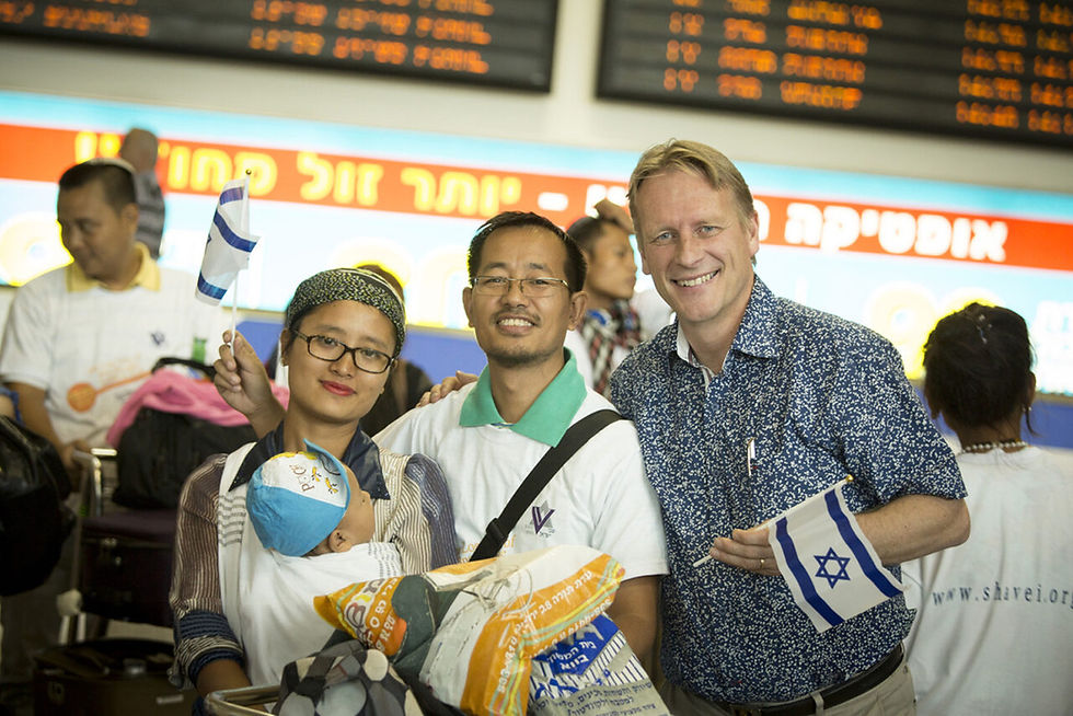 Former ICEJ International Director Juha Ketola welcomes an ICEJ-sponsored Bnei Menashe family upon their arrival in 2014